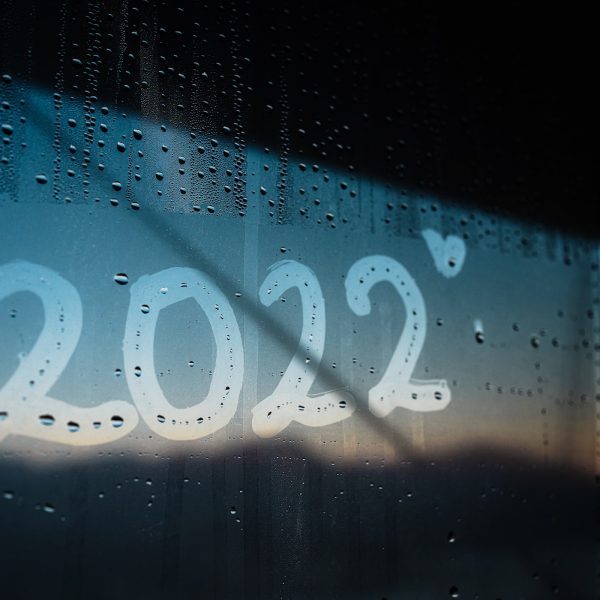 The letters 2022 are written on a steamy window, alongside a small love heart.